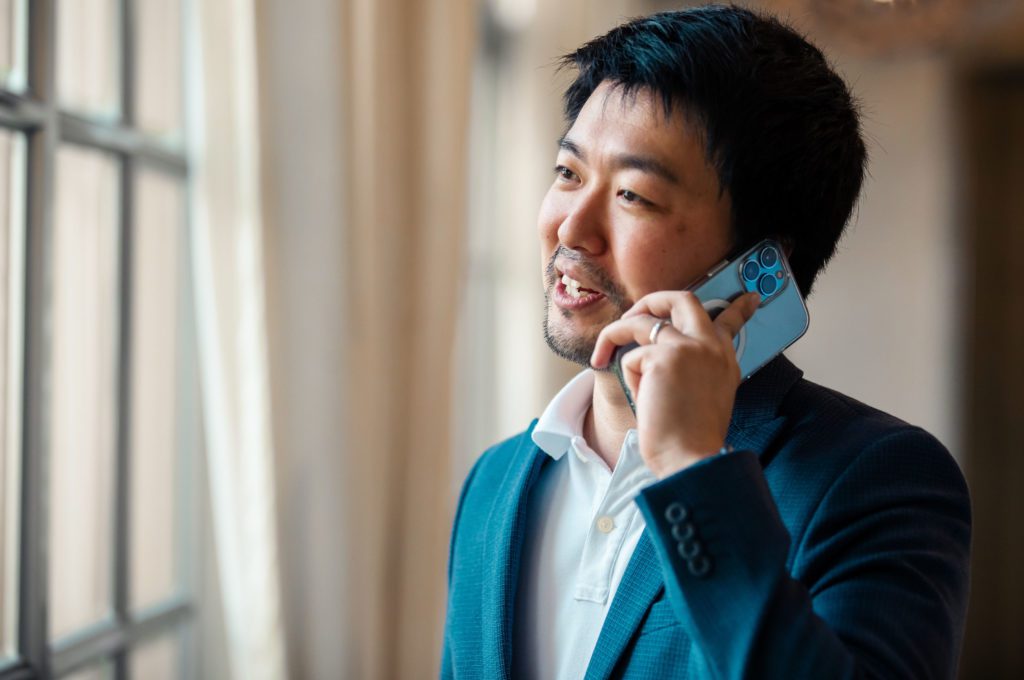 Asian man talking on phone