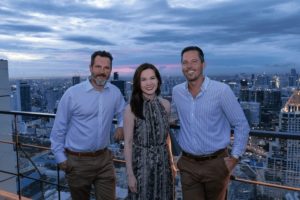 GoGlobal partners, Margaret Yip, Nick Broughton and Andrew Lindquist with view of Bangkok behind