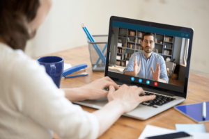 a hiring manager interviews a candidate virtually
